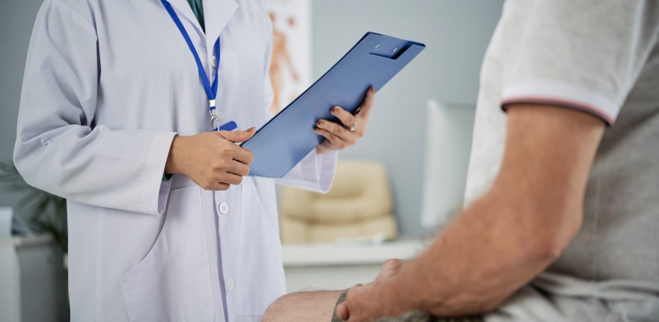 Medical practitioner asking patient questions from the list